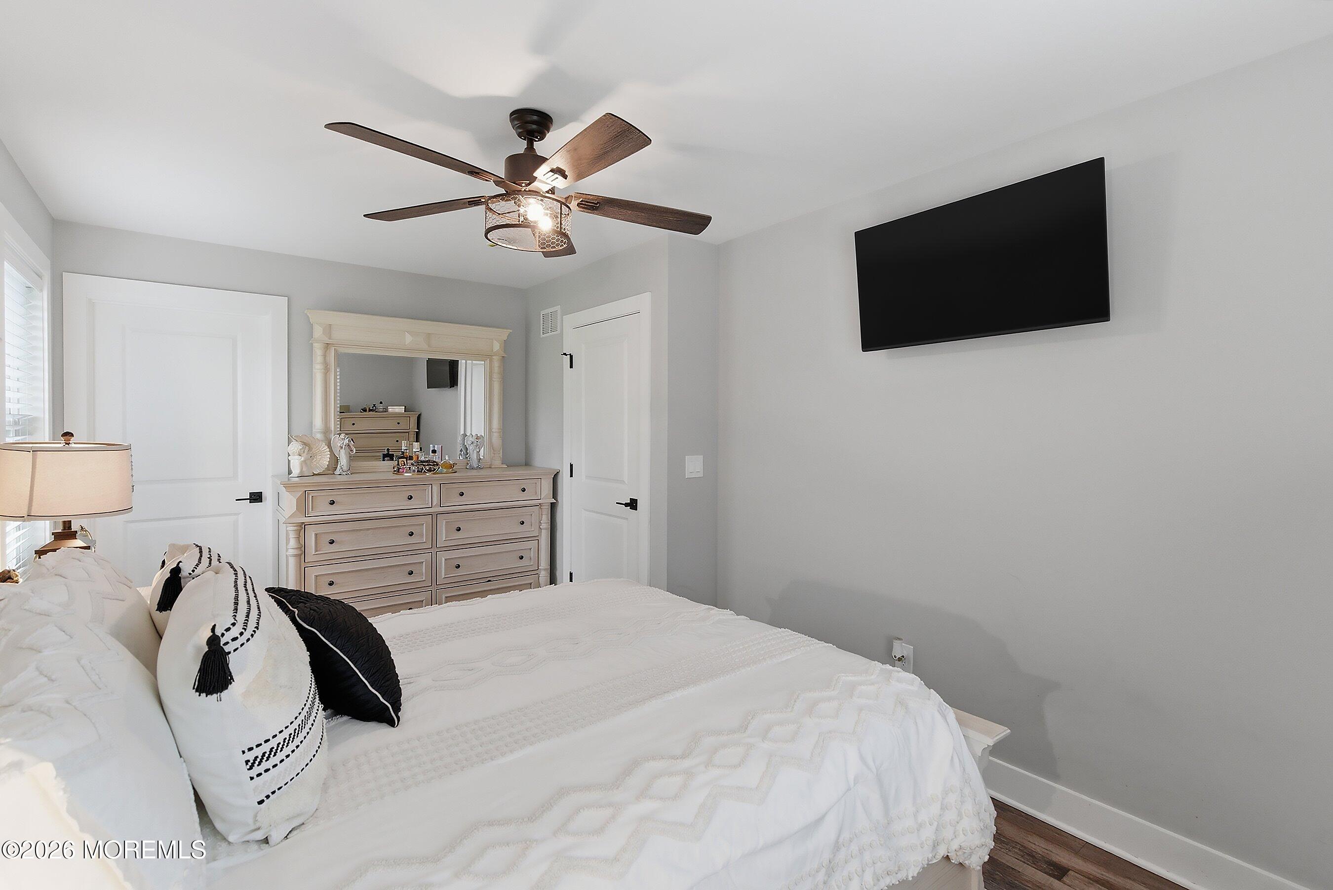 83 Whitesville Road Jackson, NJ 08527 - Photo 16 of 31 a bedroom with a bed and a flat screen tv