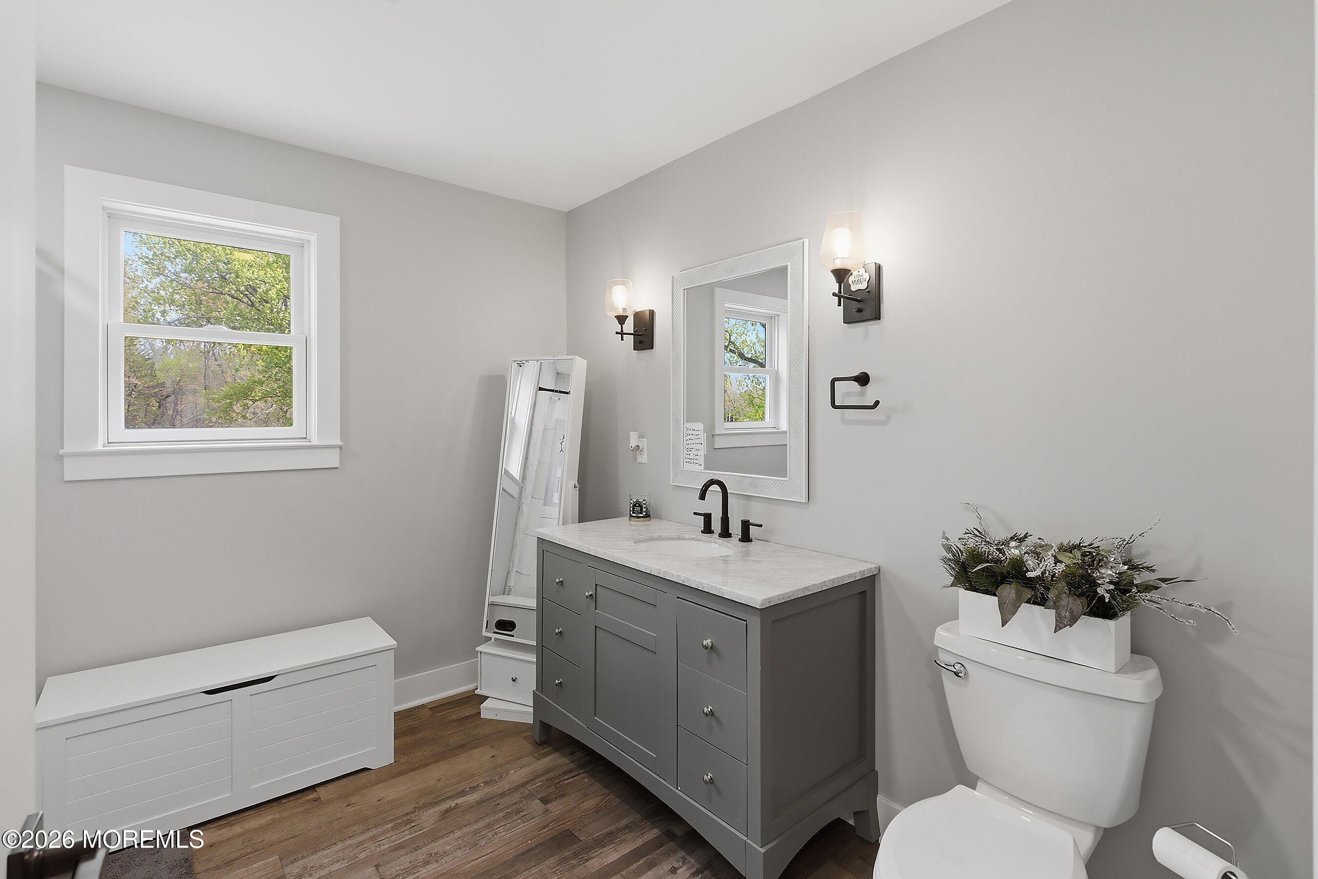 83 Whitesville Road Jackson, NJ 08527 - Photo 17 of 31 a bathroom with a toilet a sink a tub and mirror