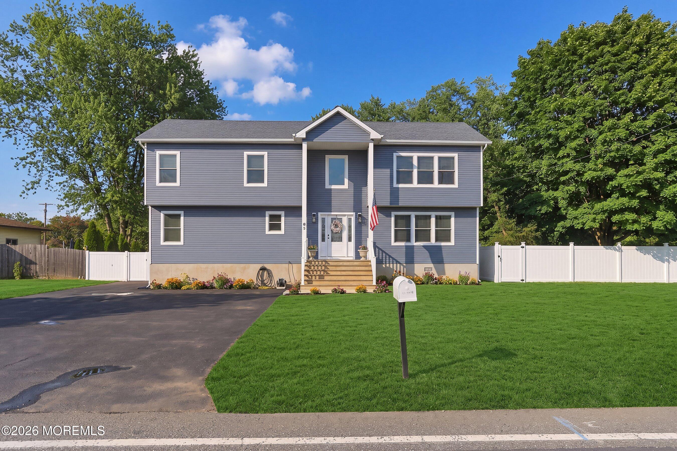 83 Whitesville Road Jackson, NJ 08527 - Photo 2 of 31 a front view of a house with a yard