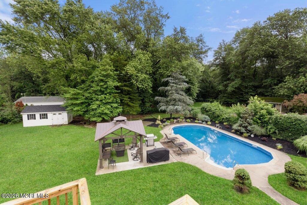 83 Whitesville Road Jackson, NJ 08527 - Photo 28 of 31 a view of a house with a swimming pool and a yard