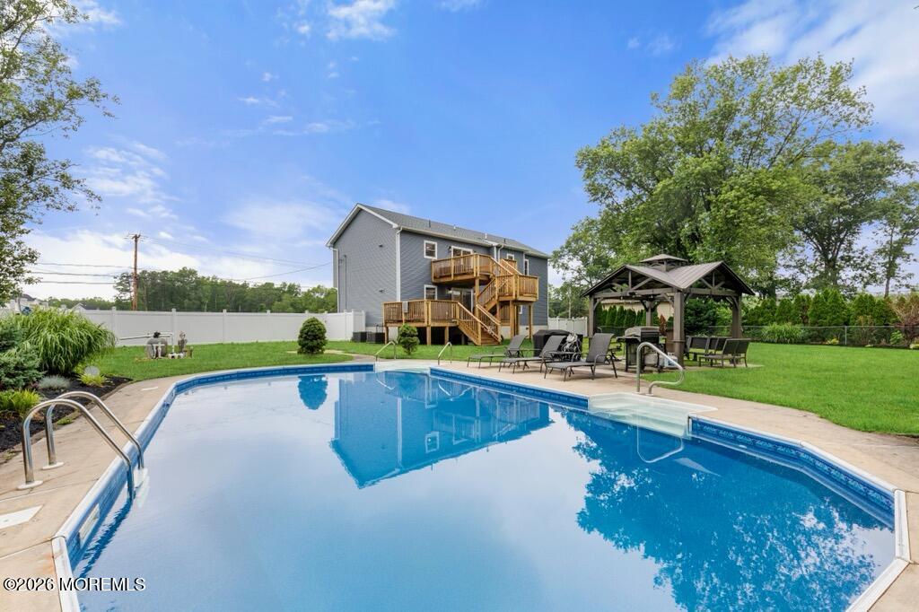 83 Whitesville Road Jackson, NJ 08527 - Photo 30 of 31 a view of a swimming pool with lawn chairs and a big yard