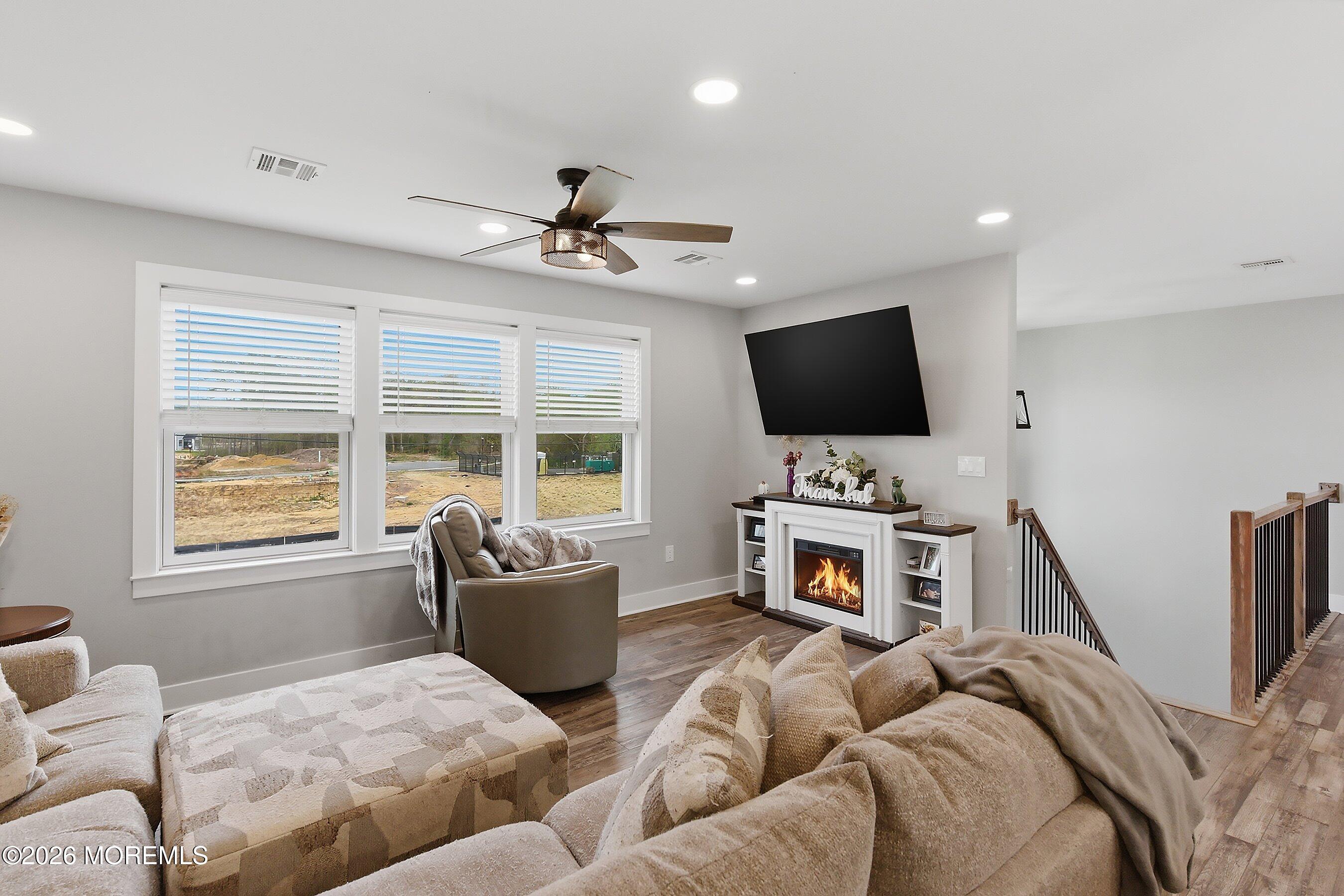 83 Whitesville Road Jackson, NJ 08527 - Photo 3 of 31 a living room with furniture and a flat screen tv