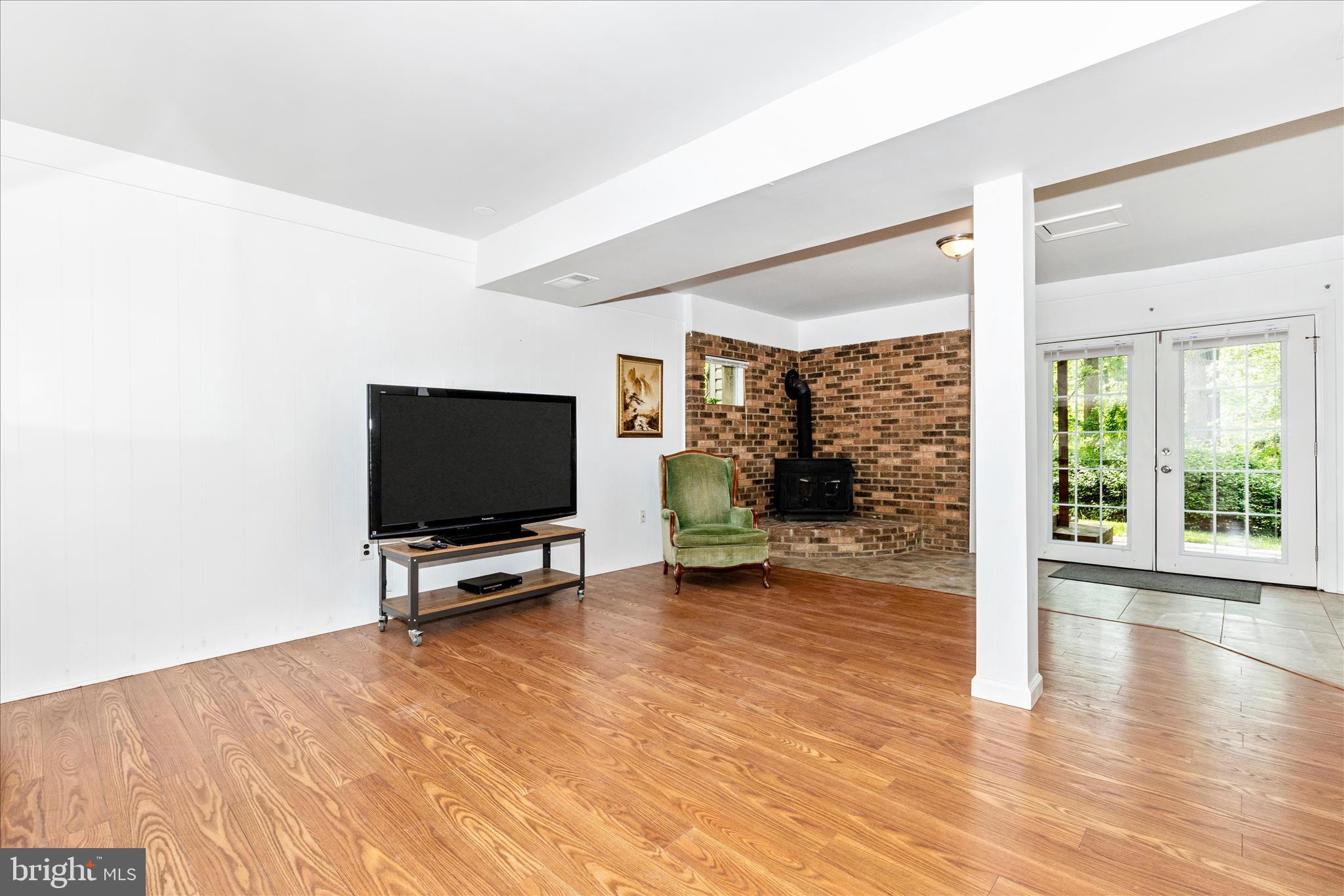7946 Helmart Drive Laurel, MD 20723 - Photo 36 of 50 Lower level rec area w woodburning stove
