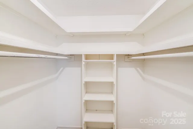 a bathroom with a sink a toilet and a large mirror