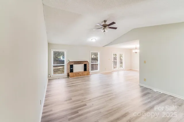 a view of a street with large trees
