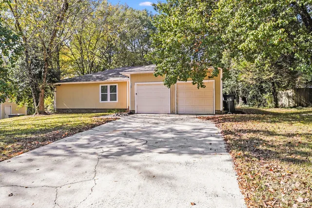 a front view of a house with a large window