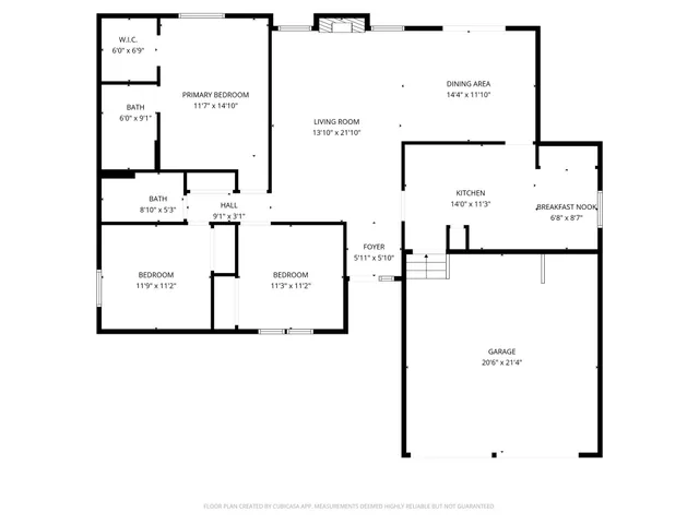 a view of a livingroom with wooden floor and a ceiling fan
