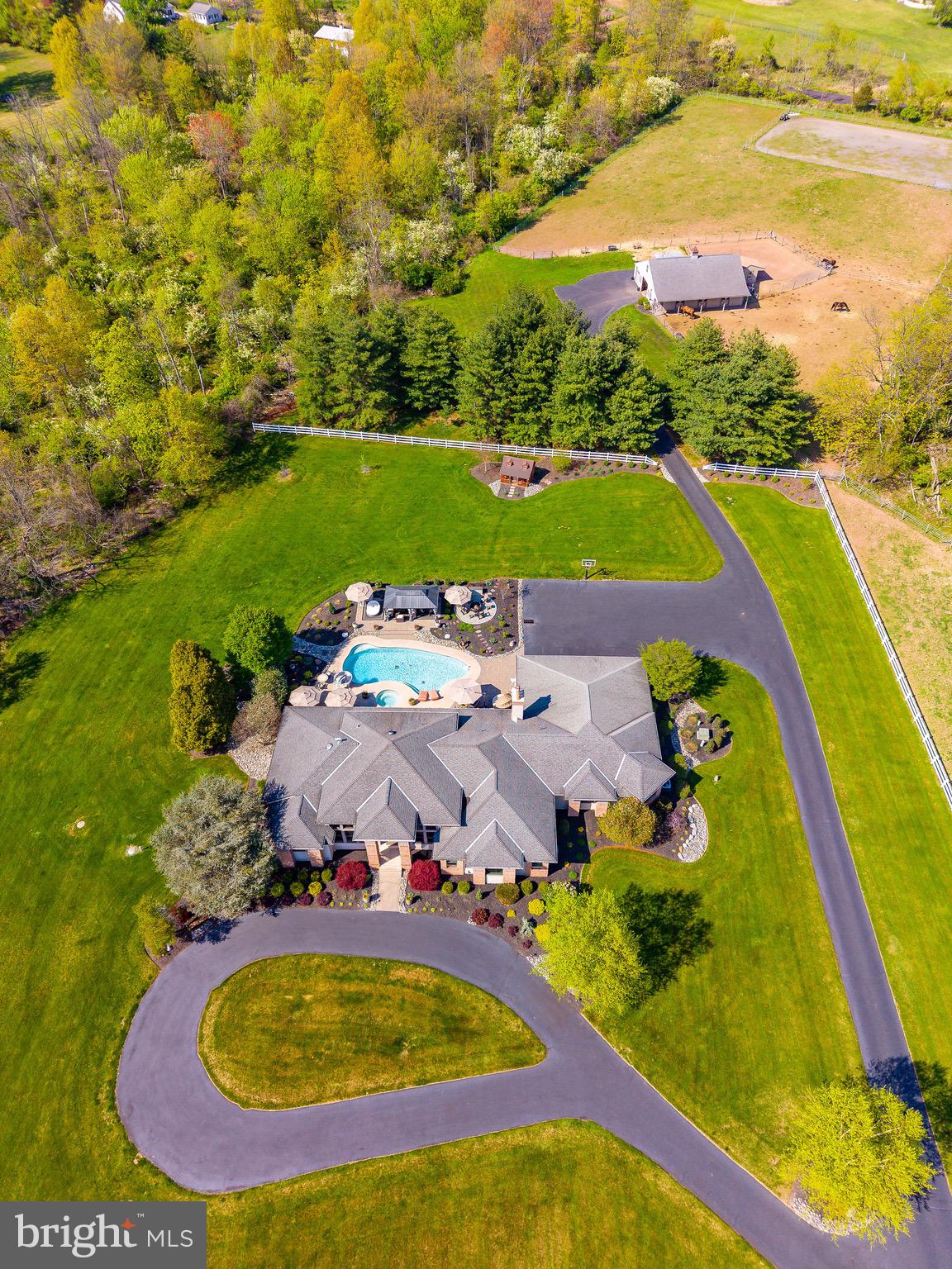 127 Fairhill School Road Hatfield, PA 19440 - Photo 60 of 73 an aerial view of a swimming pool with lawn chairs and large trees