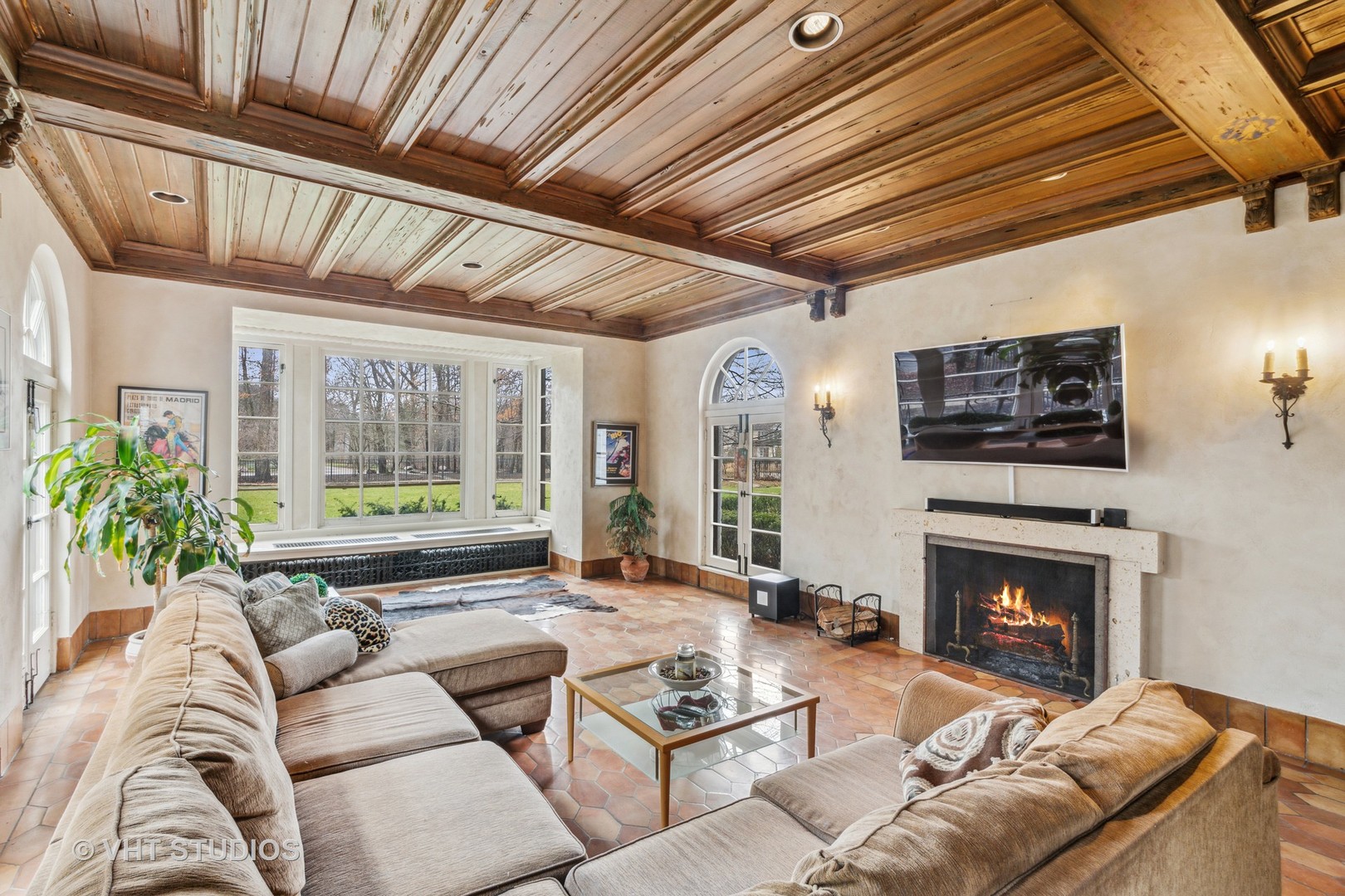 1081 Sheridan Road Highland Park, IL 60035 - Photo 11 of 28 a living room with furniture a flat screen tv and a fireplace