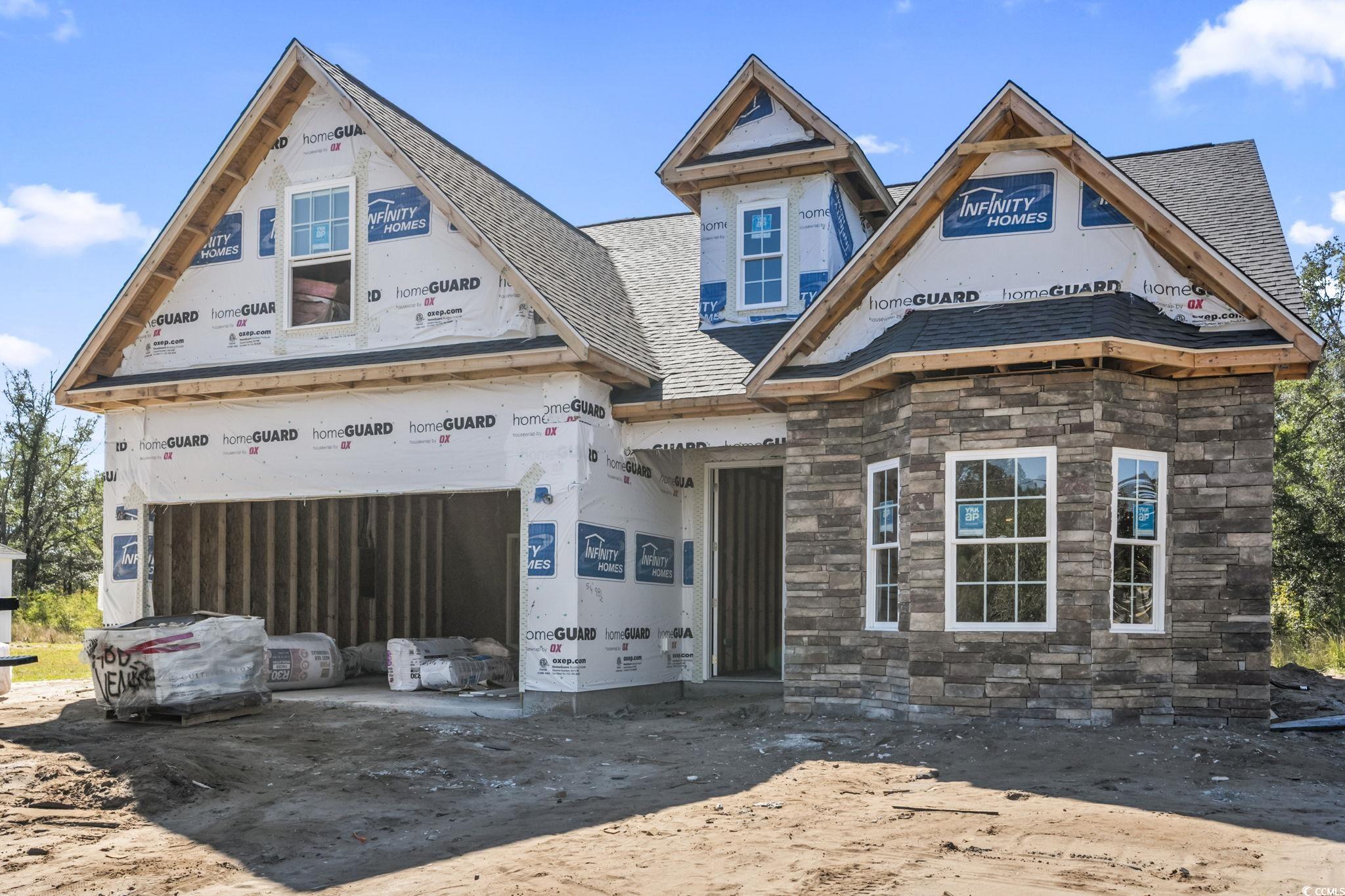 Unfinished property with stone siding