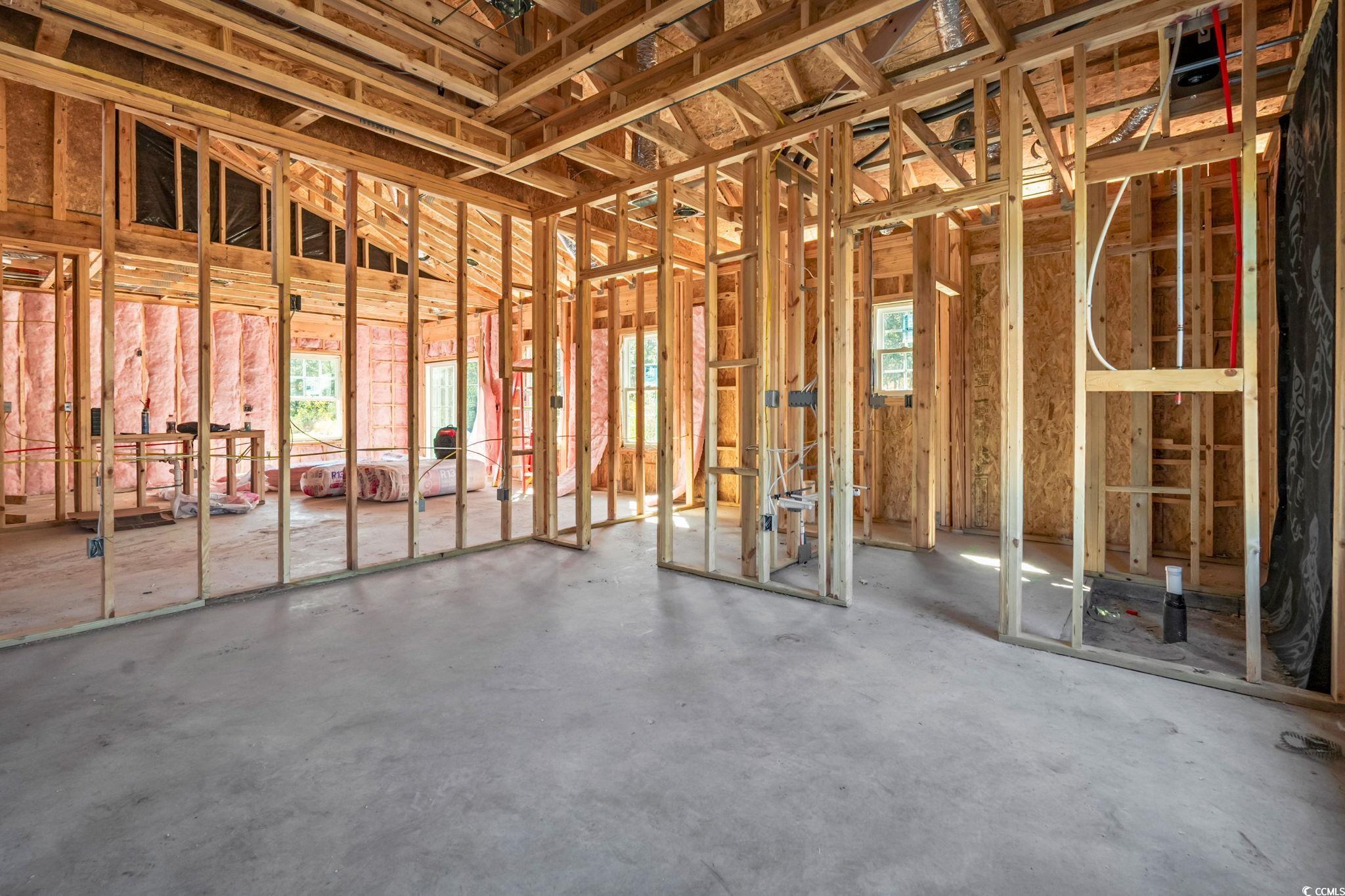 2090 Highway 9 Business Loris, SC 29569 - Photo 12 of 19 Bathroom features porcelain tile flooring and shower walls to ceiling with niche, white shaker soft-close cabinets, double vanities, and granite countertops.