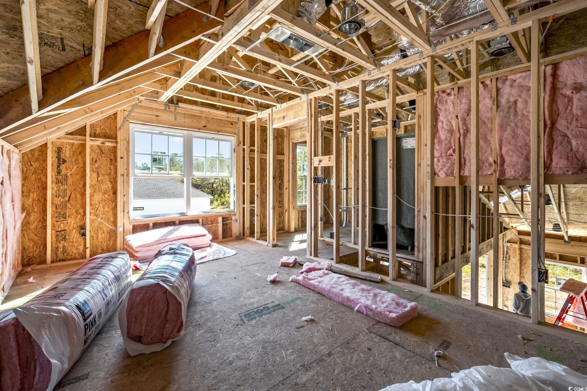 2090 Highway 9 Business Loris, SC 29569 - Photo 13 of 19 Second floor bedroom featuring a full bathroom, carpet flooring, closet, and window.