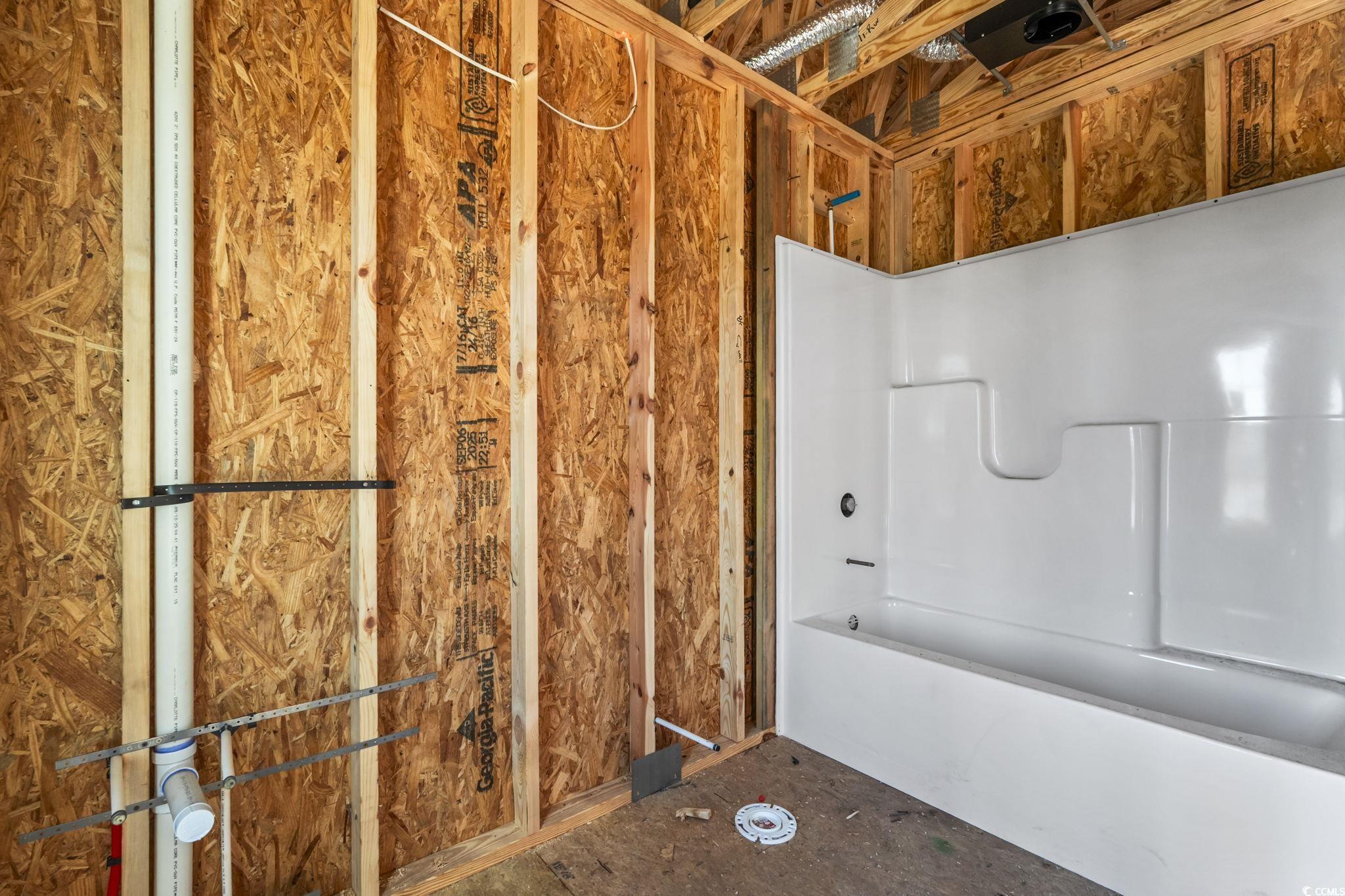 2090 Highway 9 Business Loris, SC 29569 - Photo 14 of 19 Full bathroom featuring a tub/shower combo, single vanity, granite countertops, laminate flooring.