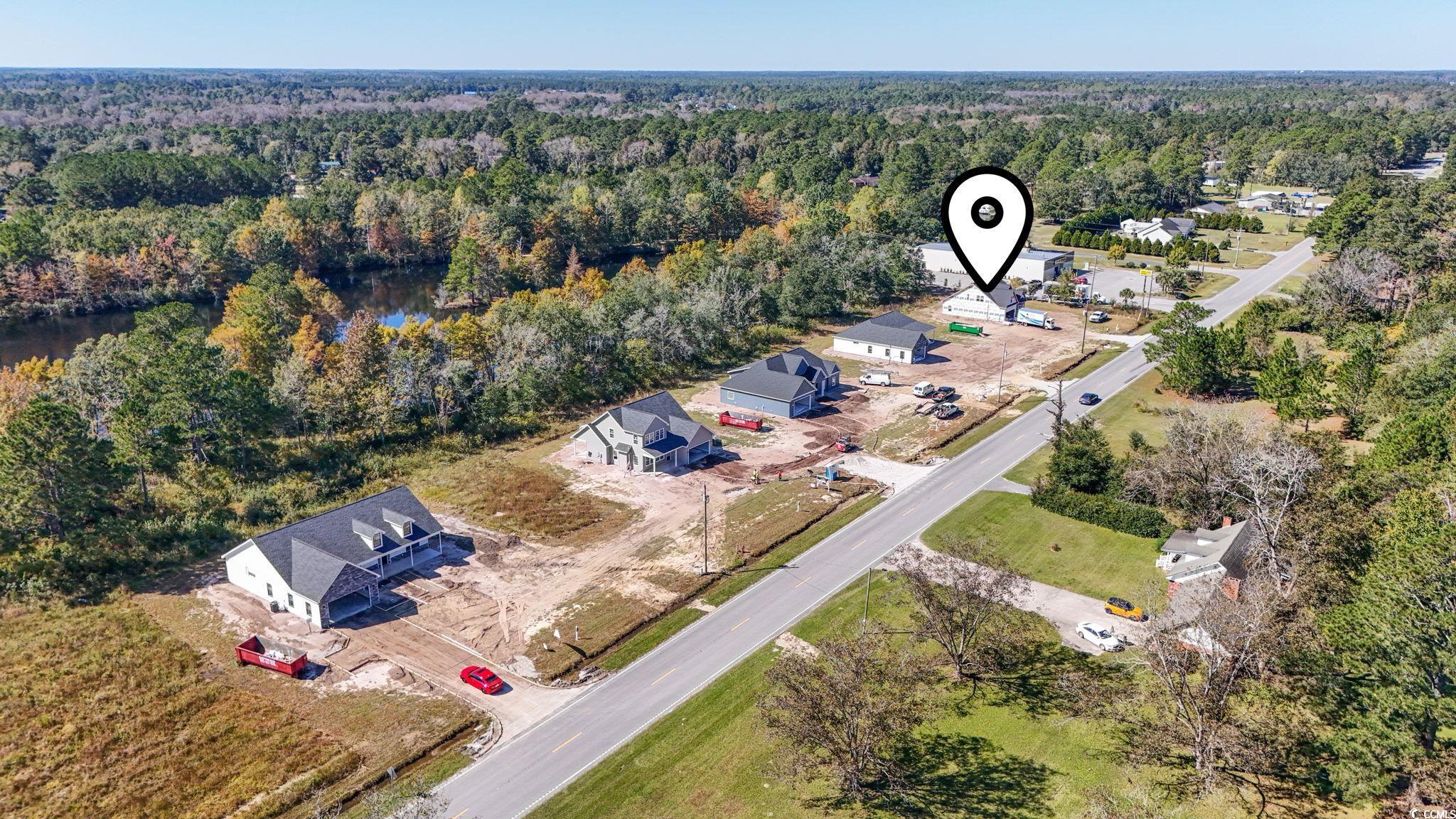 2090 Highway 9 Business Loris, SC 29569 - Photo 18 of 19 Aerial perspective of suburban area with a heavily wooded area