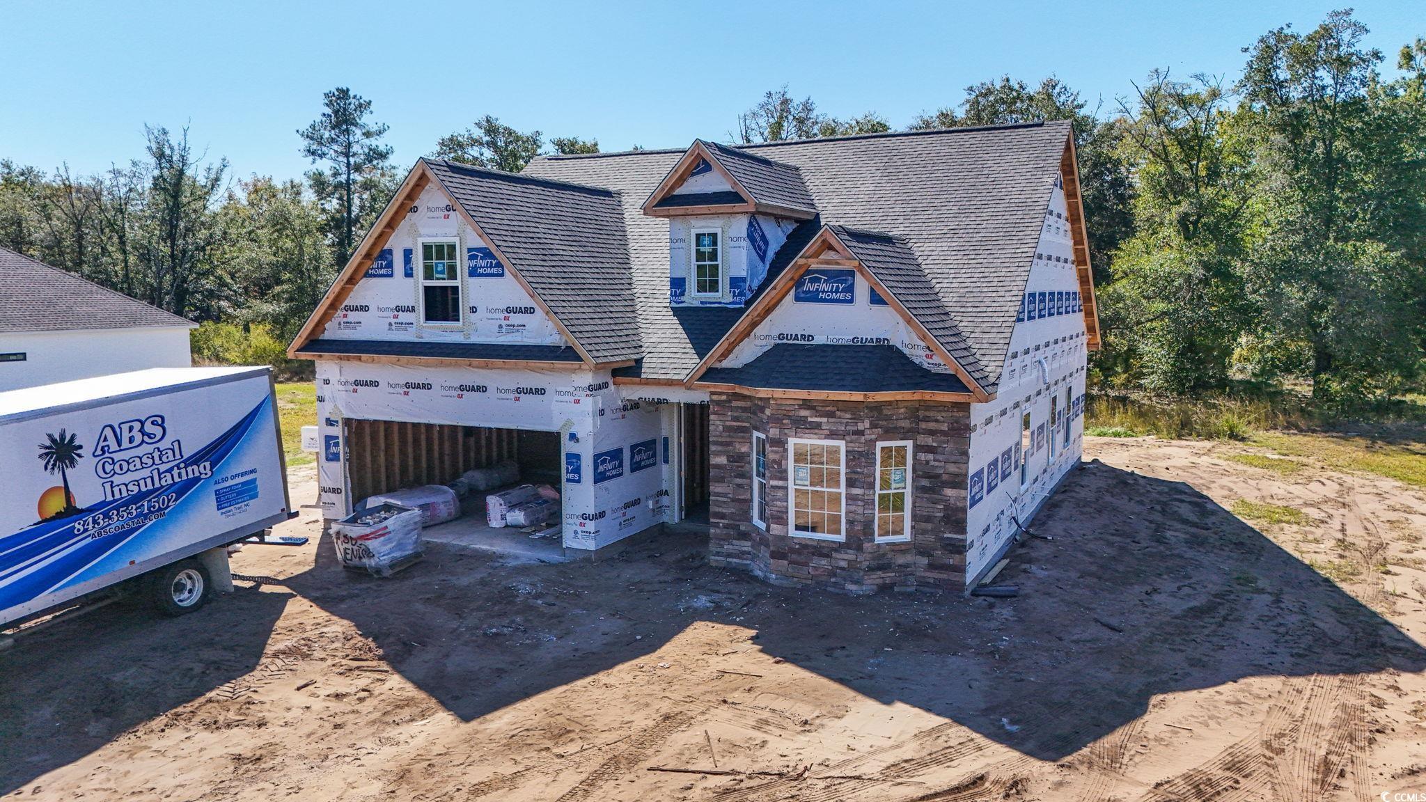 2090 Highway 9 Business Loris, SC 29569 - Photo 2 of 19 Property in mid-construction featuring driveway, a garage, and stone siding