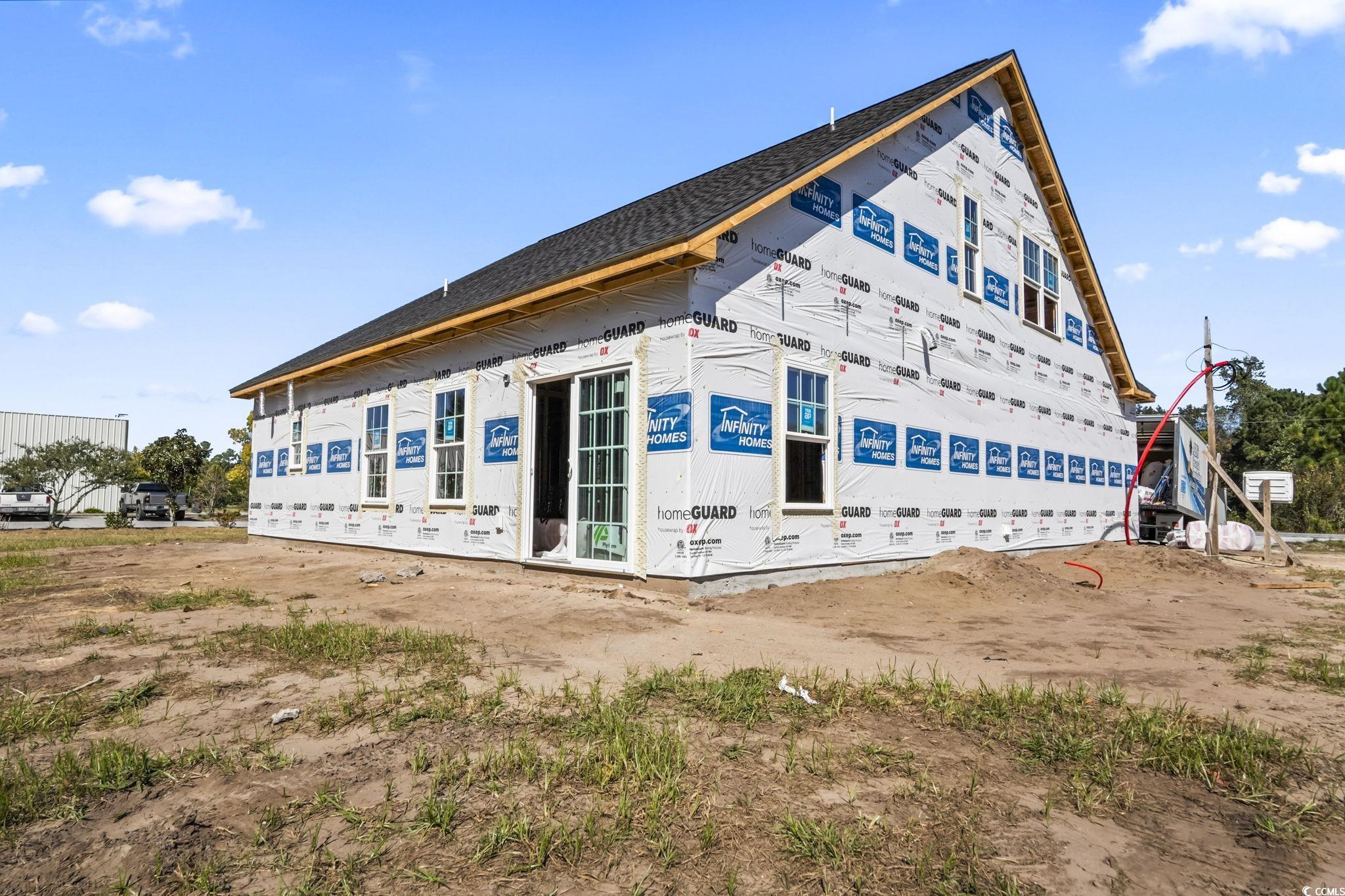 2090 Highway 9 Business Loris, SC 29569 - Photo 3 of 19 View of home's exterior featuring a shingled roof