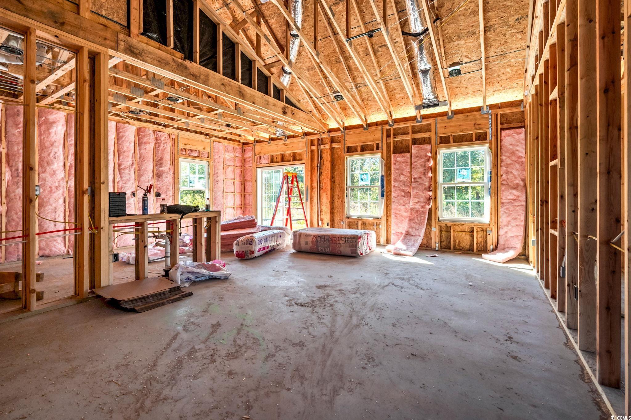 2090 Highway 9 Business Loris, SC 29569 - Photo 6 of 19 Living Room boasting vaulted ceilings, an open concept, laminate flooring, ceiling fan/light, and windows.