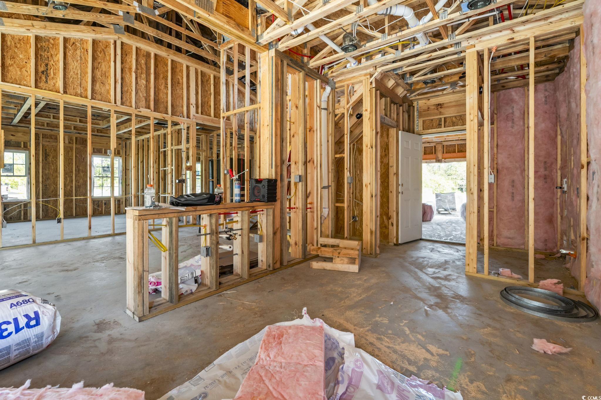 2090 Highway 9 Business Loris, SC 29569 - Photo 7 of 19 Kitchen with spacious granite countertops and work island, white shaker soft close cabinets, laminate flooring throughout, granite countertops, stainless steel GE kitchen appliances (refrigerator not included).