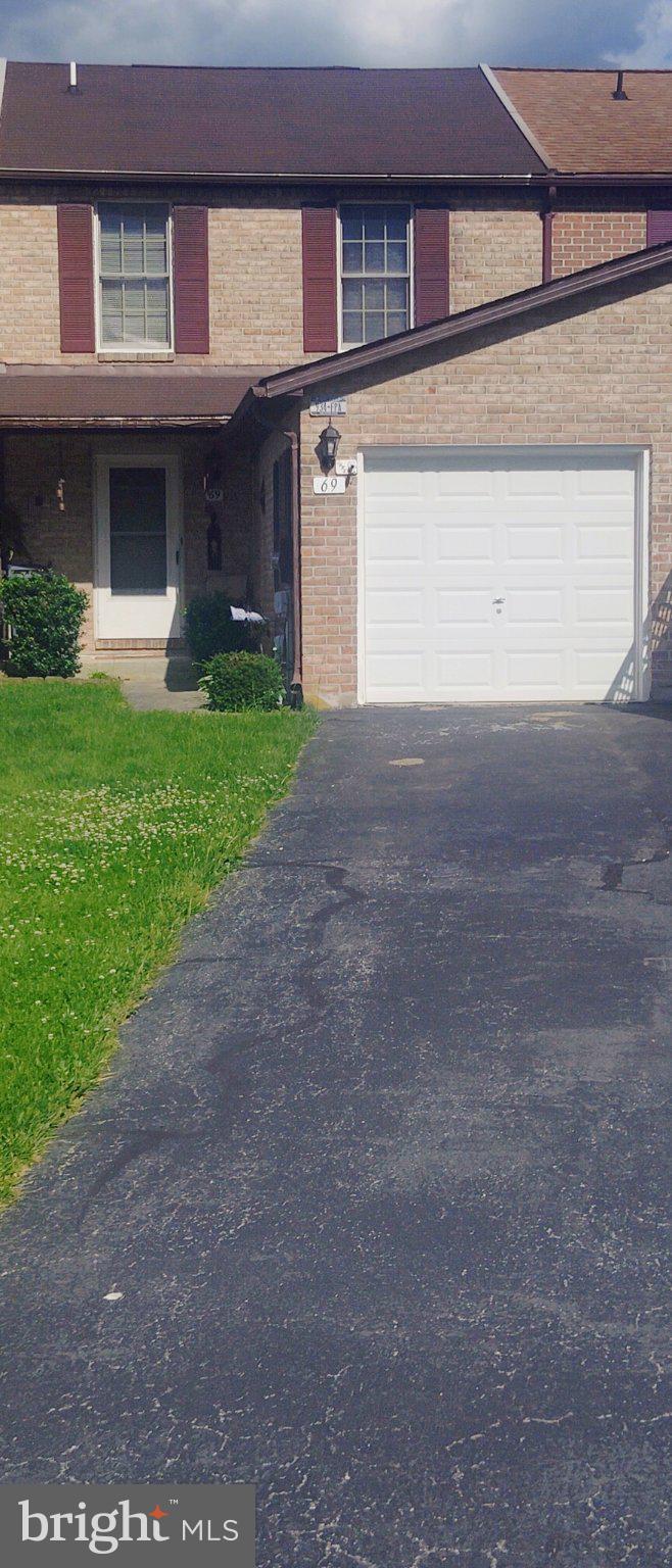 69 Johnson Smithsburg, MD 21783 - Photo 2 of 39 a front view of a house with garden