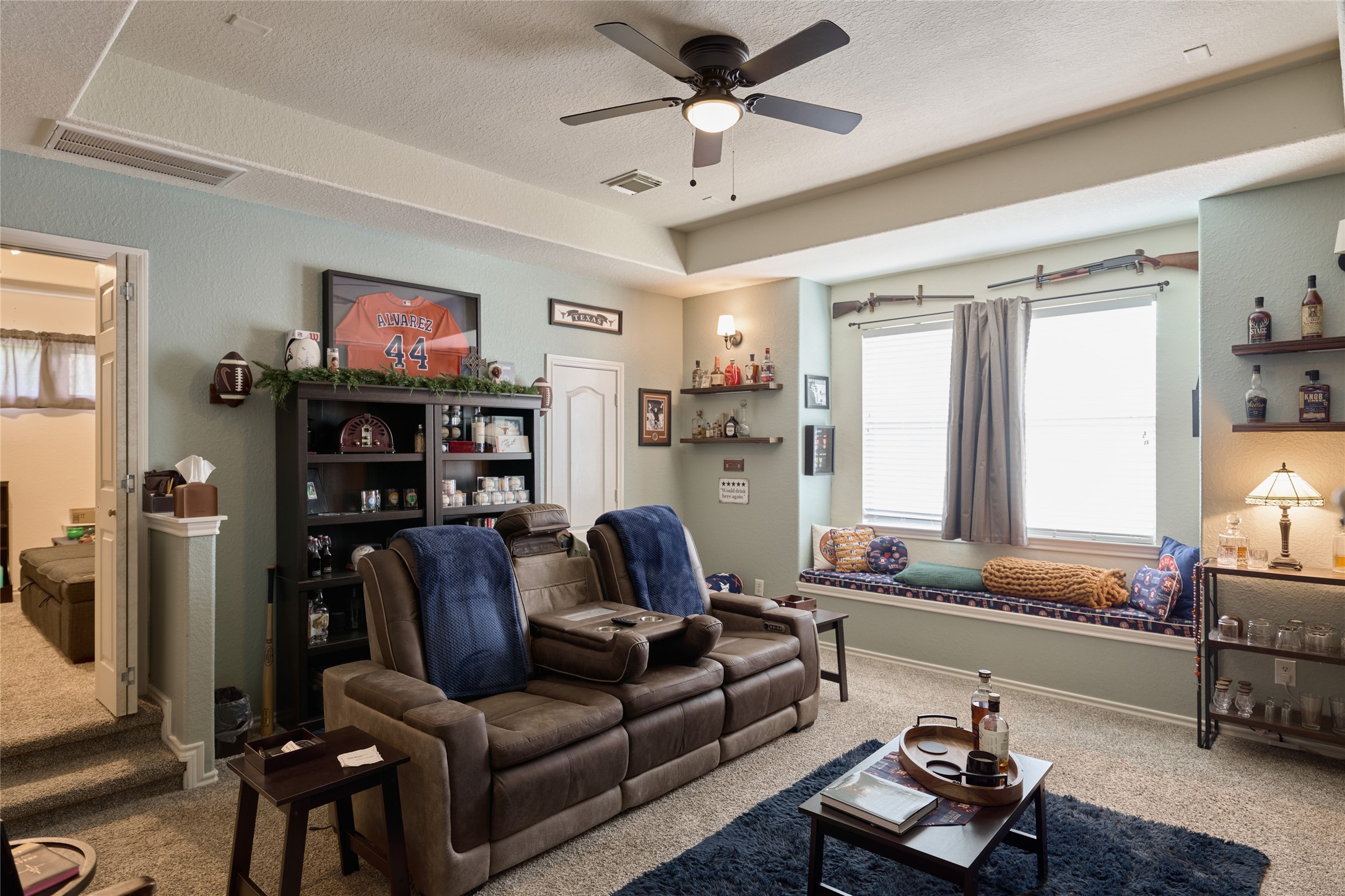 28322 Madelin Manor Lane Spring, TX 77386 - Photo 27 of 46 a living room with furniture and a flat screen tv