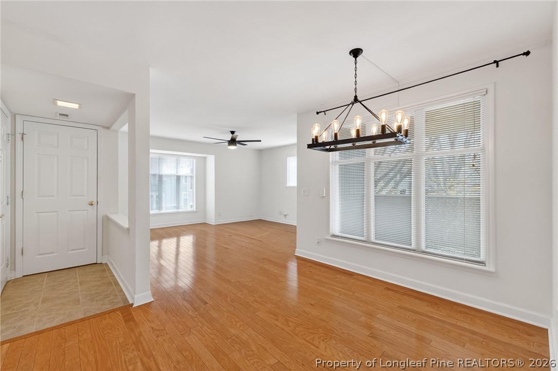 1221 Westview Lane, Unit 301 Raleigh, NC 27605 - Photo 5 of 32 a view of a room with wooden floor and windows