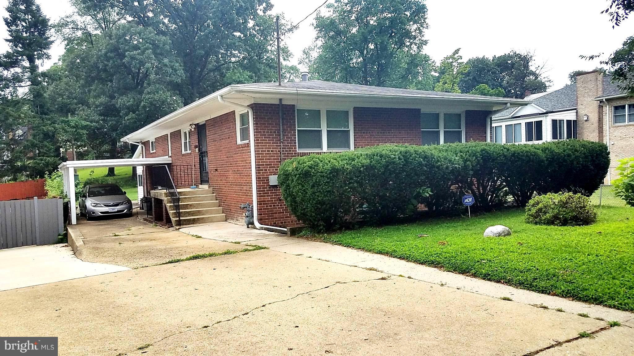 1505 Hamlin Street Northeast Washington, DC 20017 - Photo 1 of 30 a view of a house with a yard and plants