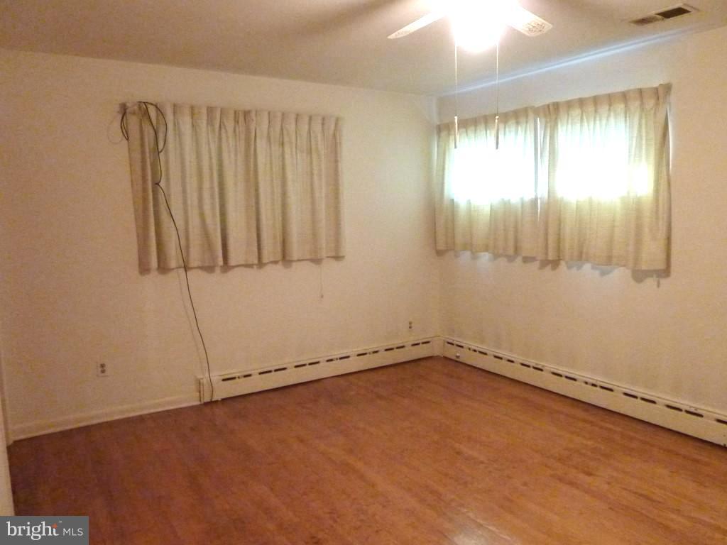 1505 Hamlin Street Northeast Washington, DC 20017 - Photo 19 of 30 an empty room with a window