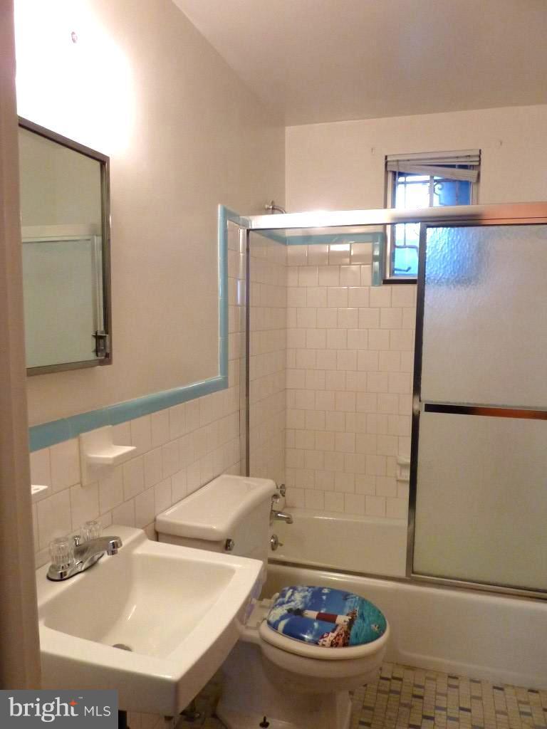 1505 Hamlin Street Northeast Washington, DC 20017 - Photo 22 of 30 a bathroom with a sink and a mirror