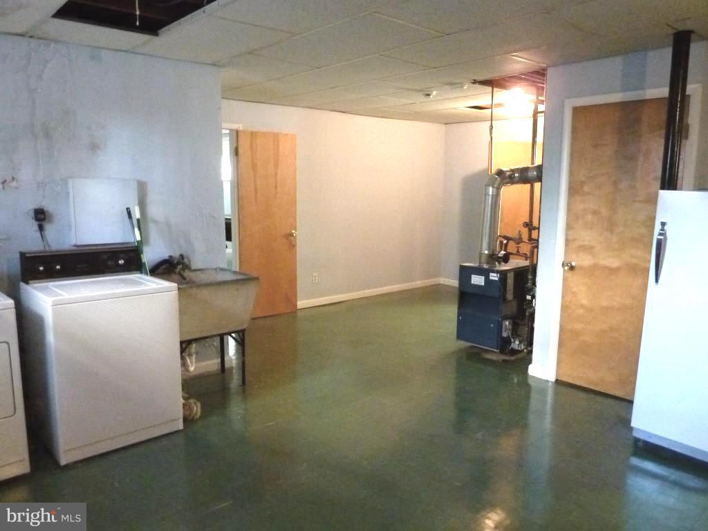 1505 Hamlin Street Northeast Washington, DC 20017 - Photo 25 of 30 a room with furniture and a chandelier