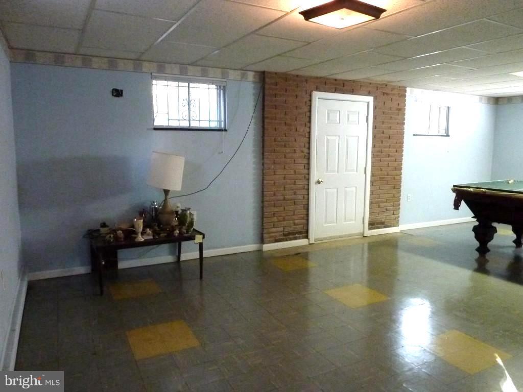 1505 Hamlin Street Northeast Washington, DC 20017 - Photo 28 of 30 a living room with furniture and a wooden floor