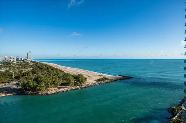 a view of a field with an ocean