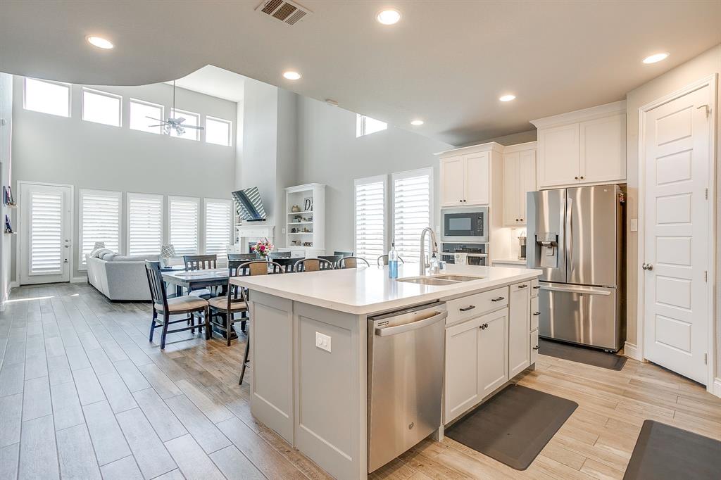 5709 Pope Creek Road Fort Worth, TX 76126 - Photo 9 of 39 The heart of the home features a bright open-concept design with soaring ceilings, abundant natural light, and a spacious kitchen perfect for everyday living and entertaining.