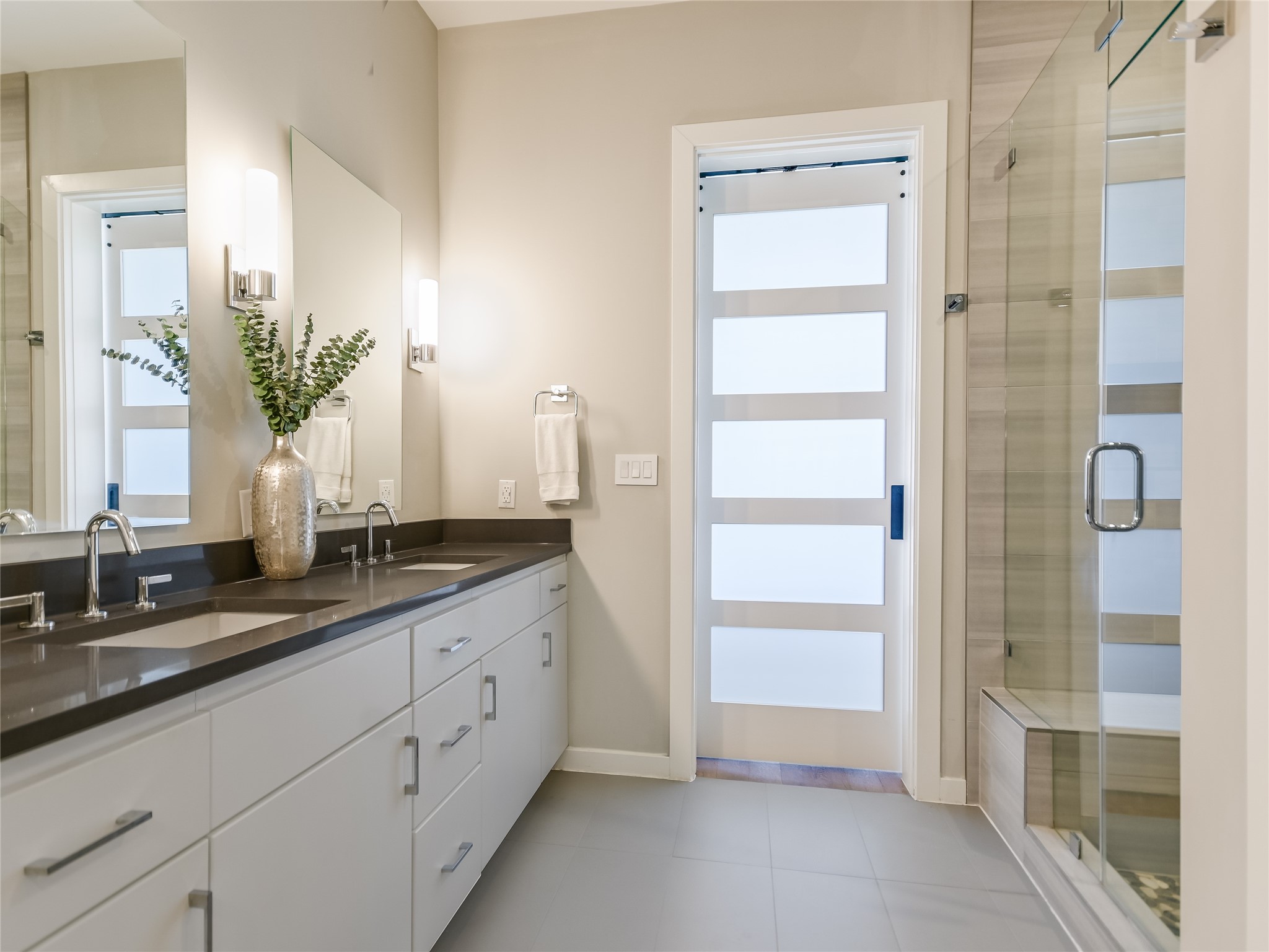 5921 Hiline Road, Unit 1501 Austin, TX 78734 - Photo 17 of 38 a spacious bathroom with a double vanity sink a mirror and a shower