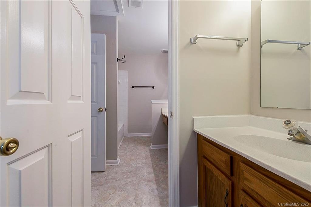 8207 Golf Ridge Drive Charlotte, NC 28277 - Photo 11 of 15 a bathroom with a sink and a mirror