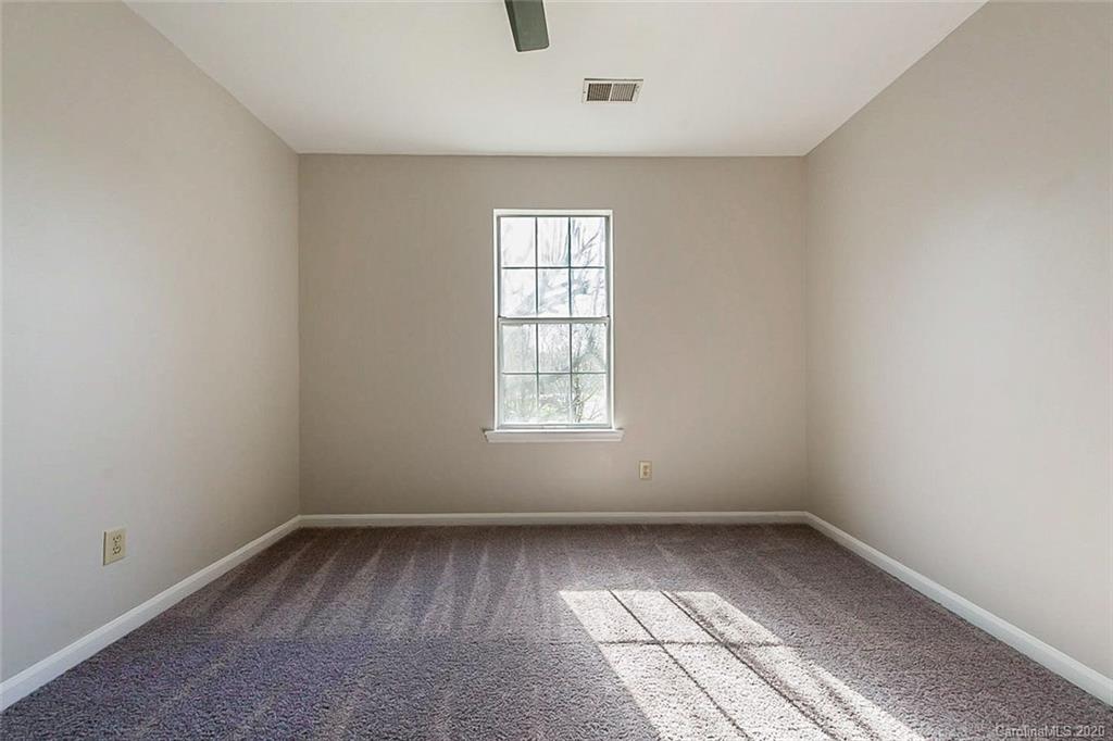 8207 Golf Ridge Drive Charlotte, NC 28277 - Photo 12 of 15 an empty room with a window