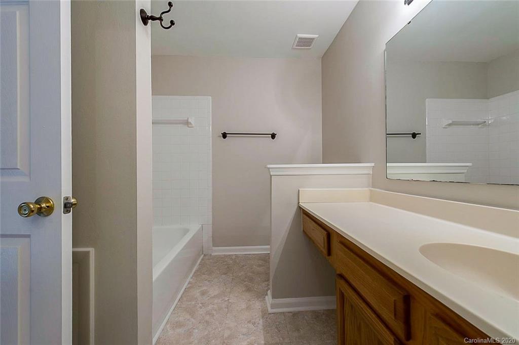 8207 Golf Ridge Drive Charlotte, NC 28277 - Photo 13 of 15 a bathroom with a sink and mirror