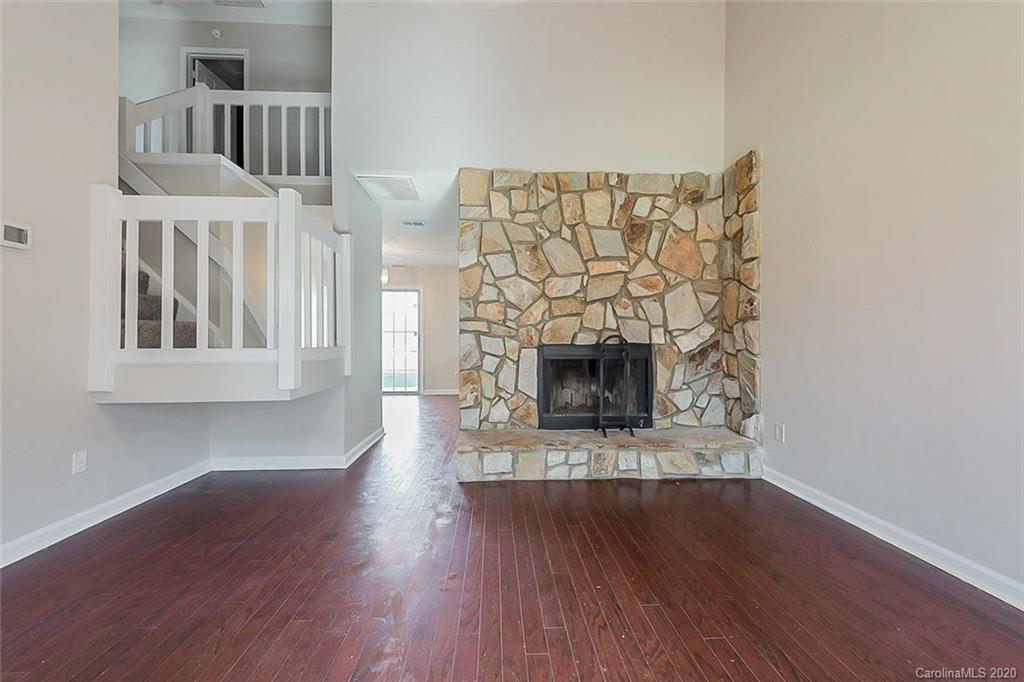 8207 Golf Ridge Drive Charlotte, NC 28277 - Photo 3 of 15 a view of a livingroom with wooden floor and a fireplace
