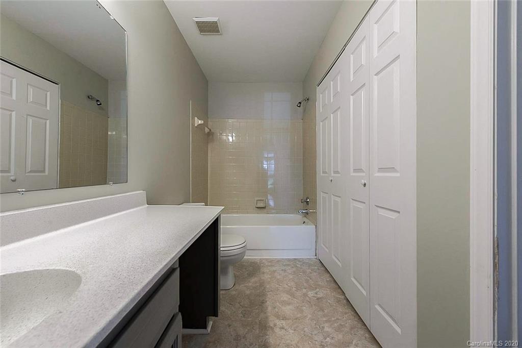 8207 Golf Ridge Drive Charlotte, NC 28277 - Photo 4 of 15 a bathroom with a sink a toilet and shower