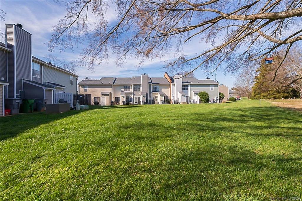 8207 Golf Ridge Drive Charlotte, NC 28277 - Photo 5 of 15 a view of a house with a big yard and large trees