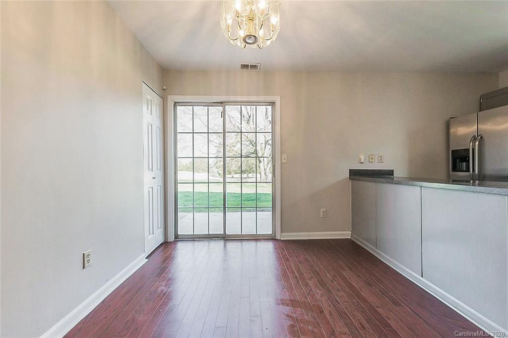 8207 Golf Ridge Drive Charlotte, NC 28277 - Photo 7 of 15 wooden floor in an empty room with a window