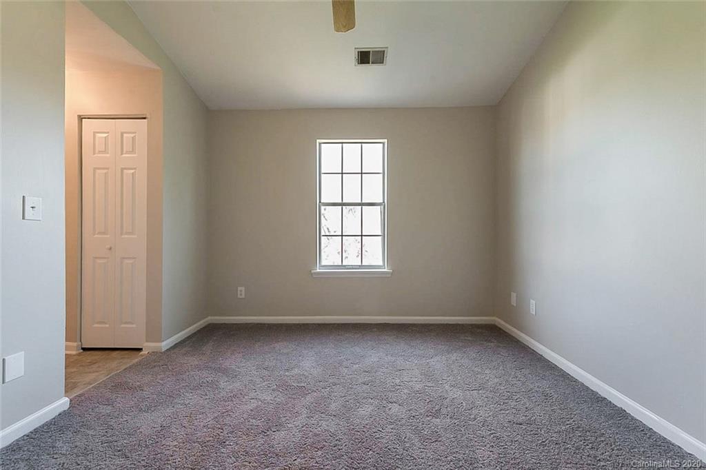 8207 Golf Ridge Drive Charlotte, NC 28277 - Photo 10 of 15 an empty room with a window