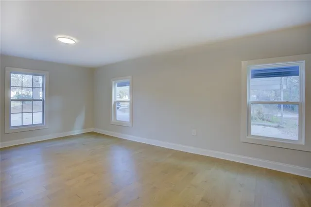 a kitchen with stainless steel appliances a sink stove refrigerator and cabinets