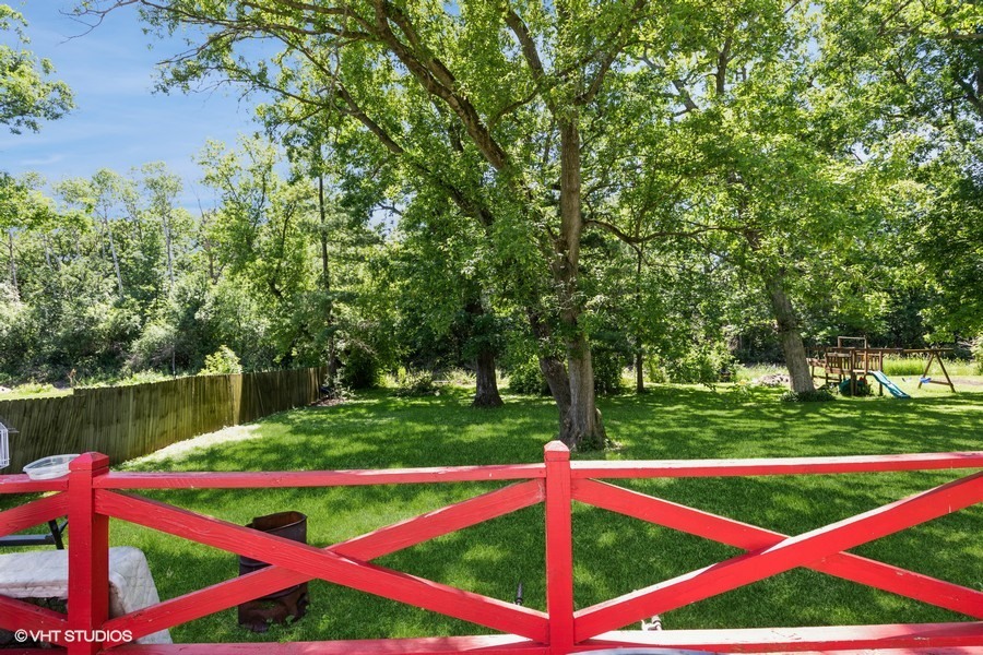 6415 North Shore Avenue Spring Grove, IL 60081 - Photo 12 of 18 a view of a yard with swimming pool and green space