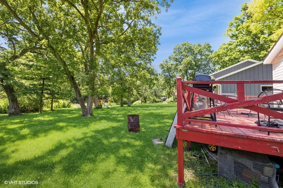 6415 North Shore Avenue Spring Grove, IL 60081 - Photo 13 of 18 a view of a yard with a deck