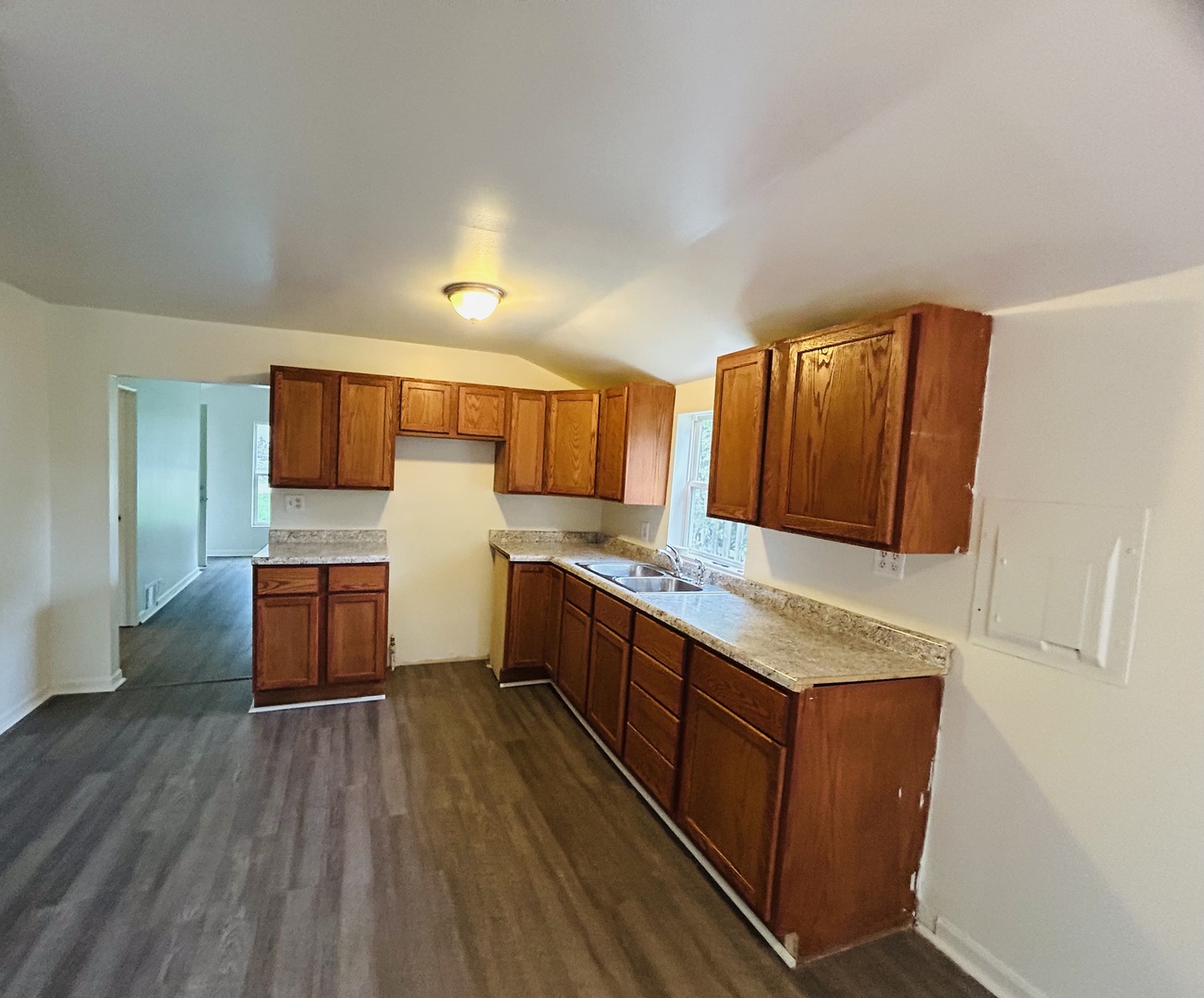 6415 North Shore Avenue Spring Grove, IL 60081 - Photo 9 of 18 a kitchen with stainless steel appliances granite countertop a lot of counter space and wooden floor