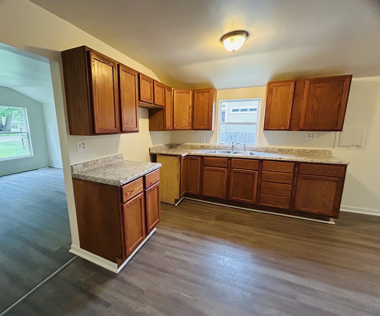 6415 North Shore Avenue Spring Grove, IL 60081 - Photo 9 of 15 a kitchen with stainless steel appliances granite countertop a sink and a stove