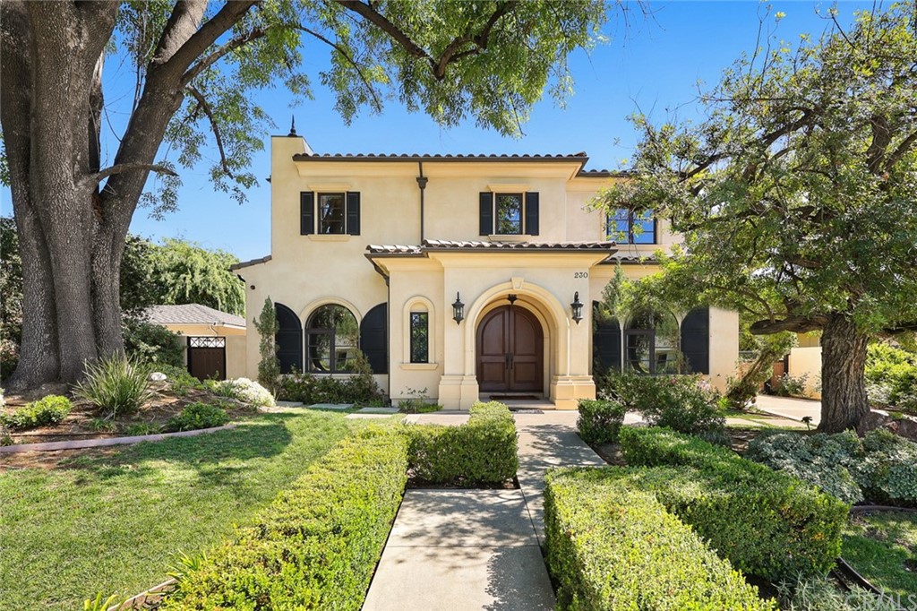 a view of a house with a small yard