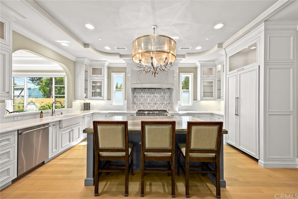 230 San Miguel Drive Arcadia, CA 91007 - Photo 14 of 57 a large kitchen with a table and chairs in it