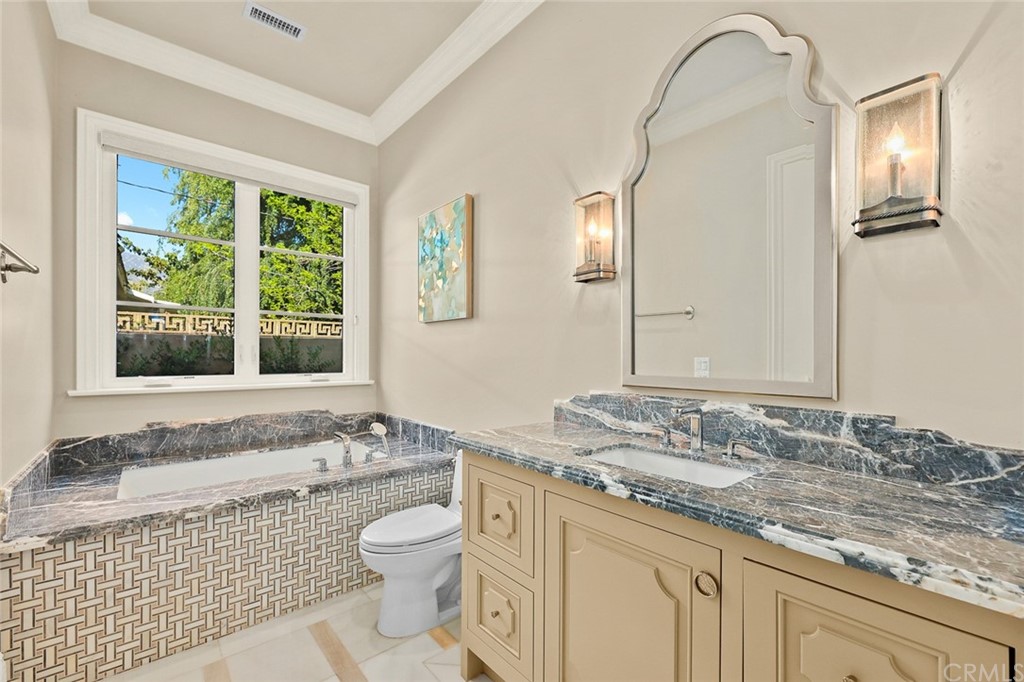 230 San Miguel Drive Arcadia, CA 91007 - Photo 31 of 57 a bathroom with a granite countertop sink and mirror with bathtub