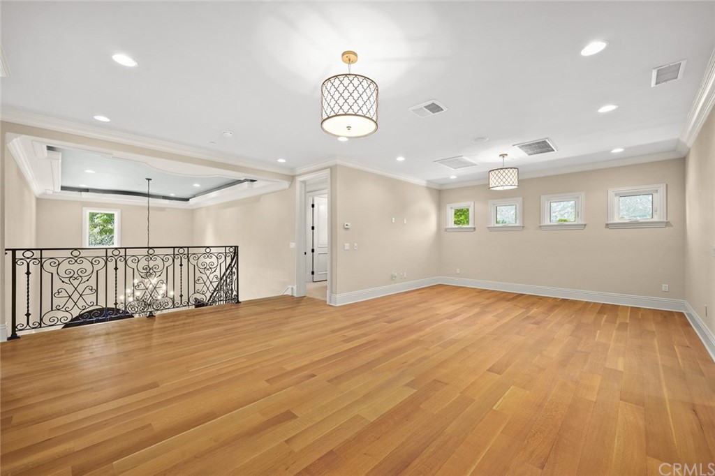 230 San Miguel Drive Arcadia, CA 91007 - Photo 34 of 57 a view of an empty room with wooden floor and a window